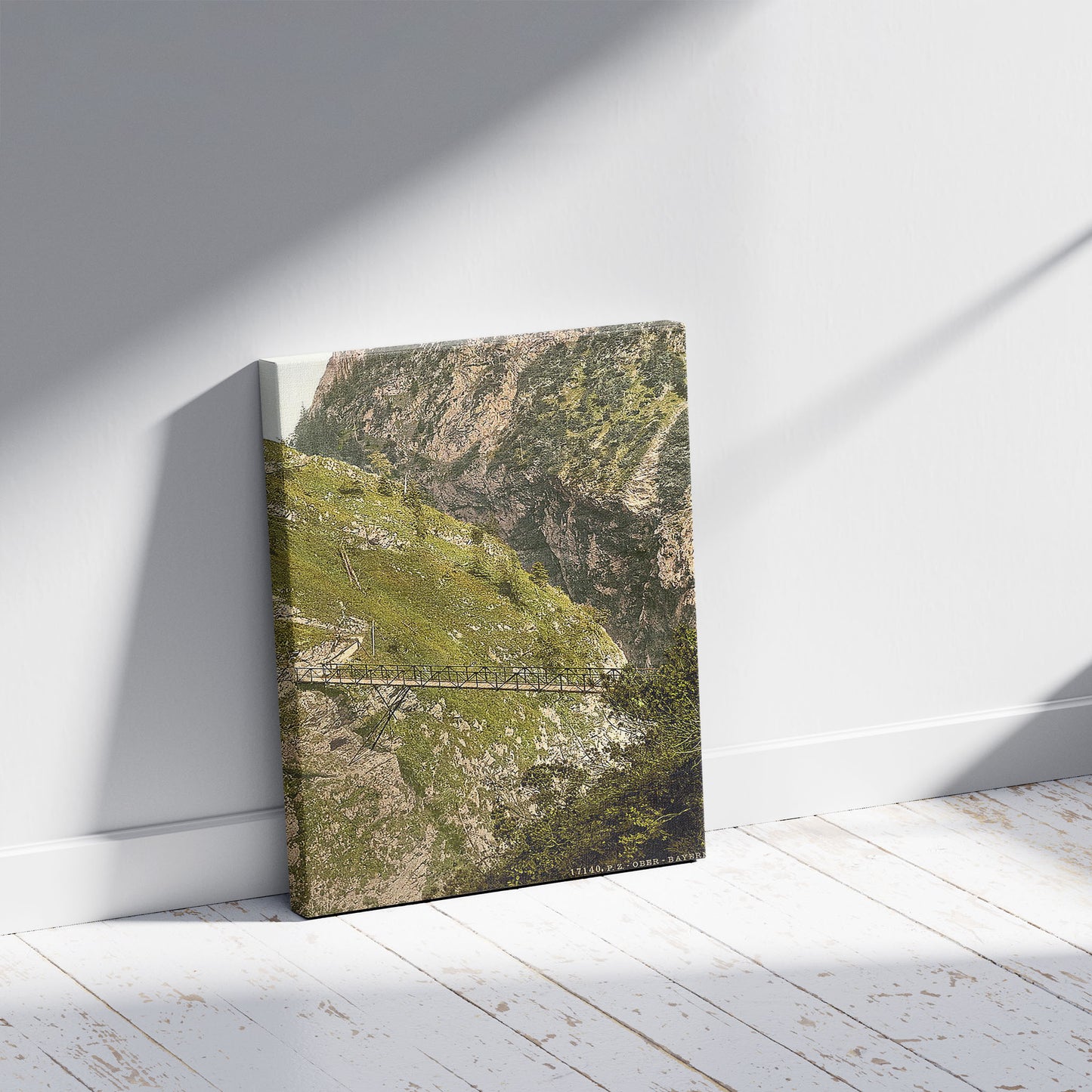 A picture of A bridge, Hollenthalklamm, Upper Bavaria, Germany, a mockup of the print leaning against a wall