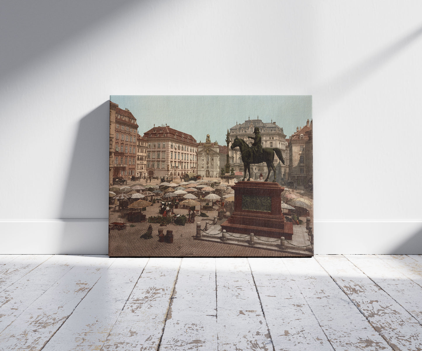 A picture of Am Hof, Vienna, Austria, with open air market and equestrian statue in foreground
