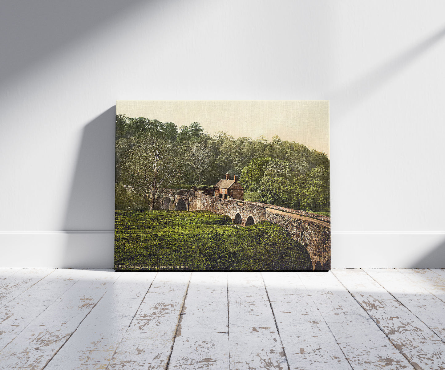 A picture of Ambergate, Halfpenny Bridge, Derbyshire, England, a mockup of the print leaning against a wall