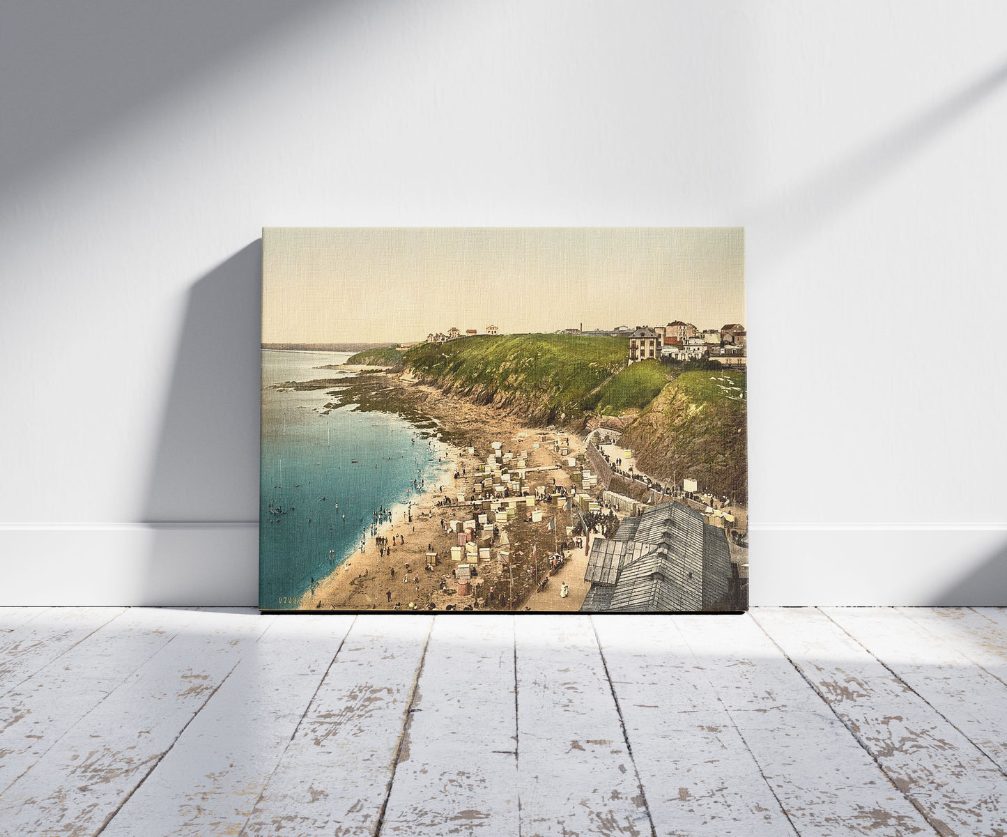 A picture of Beach at bathing time, Granville, France, a mockup of the print leaning against a wall