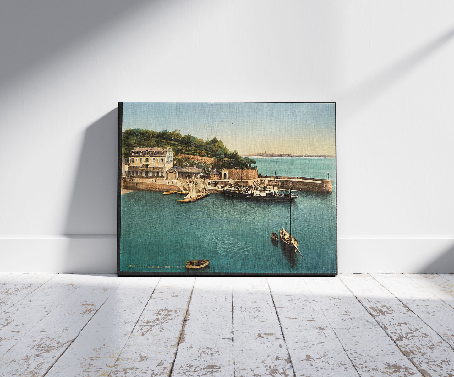 A picture of Bec de la Vallee, Dinard, France, a mockup of the print leaning against a wall