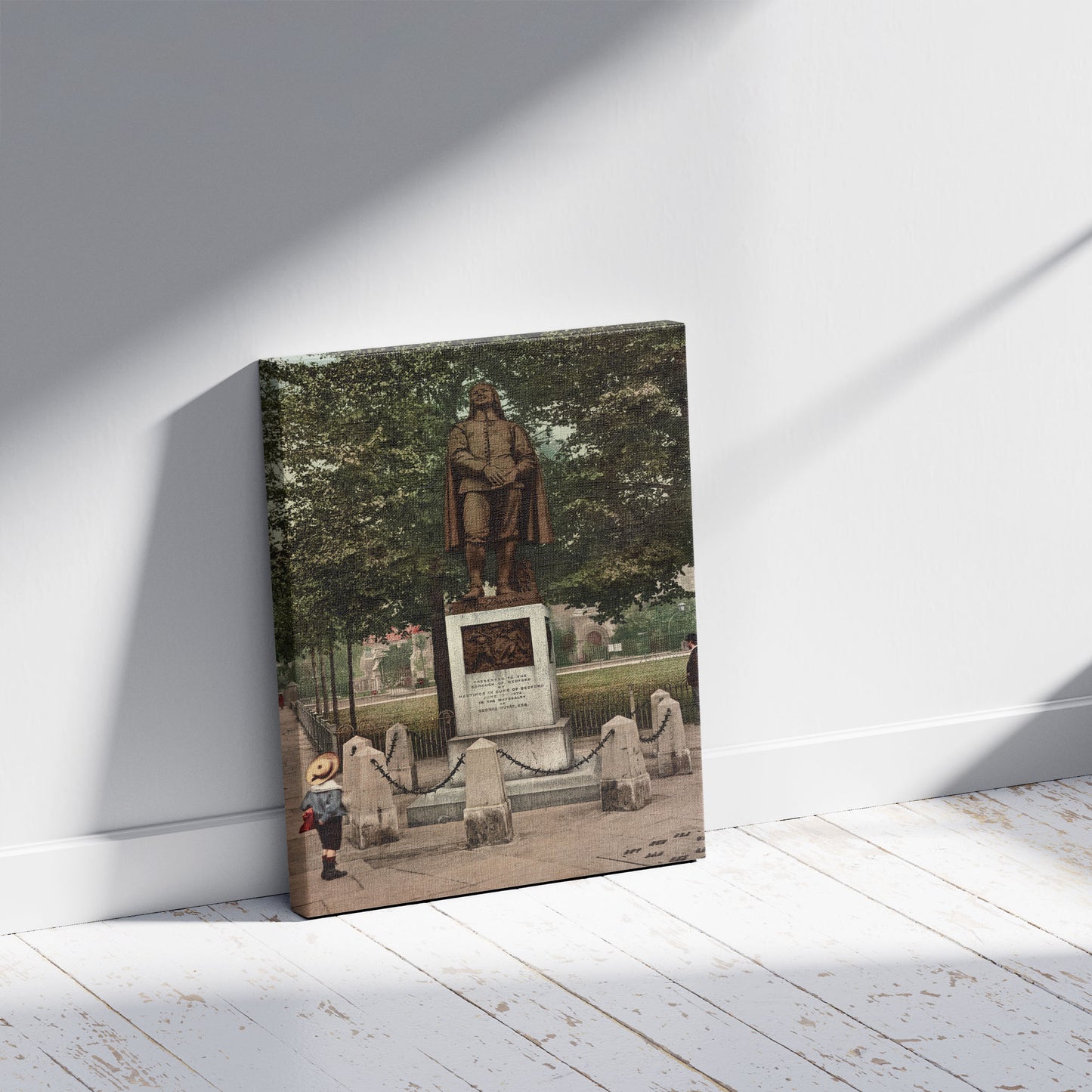 A picture of Bedford. Bunyan's Statue, a mockup of the print leaning against a wall