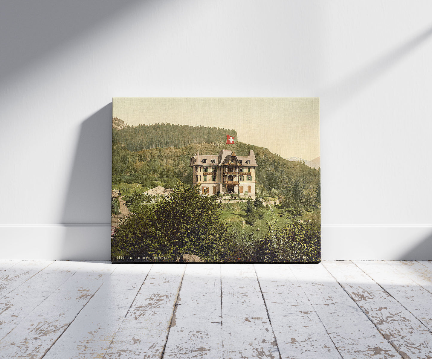 A picture of Brunig Spring House, Brunig, Bernese Oberland, Switzerland, a mockup of the print leaning against a wall