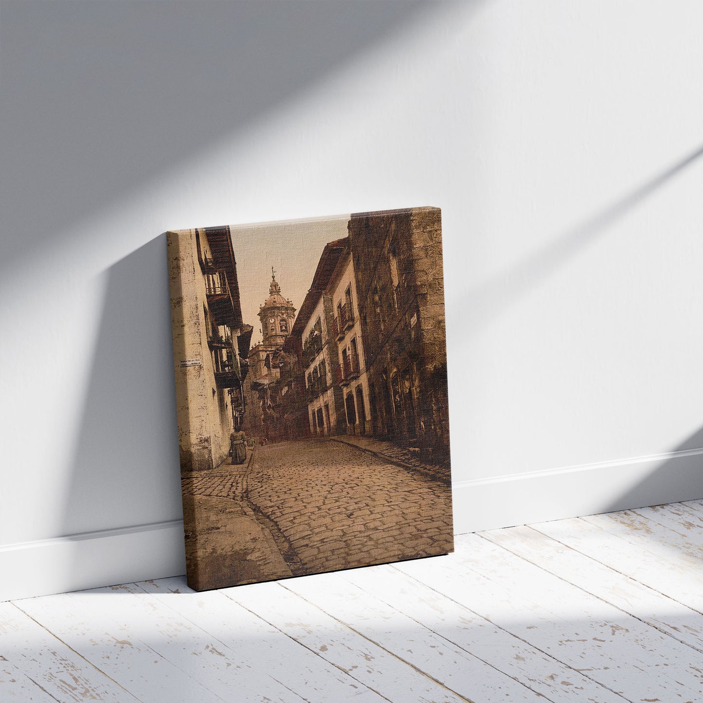 A picture of Calle Mayor, Fuenterrabía, Spain, a mockup of the print leaning against a wall