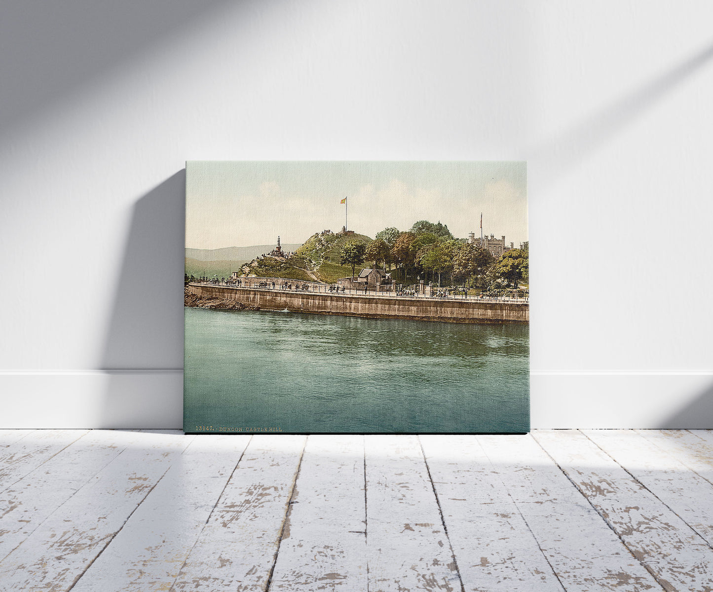 A picture of Castle Hill, Dunoon, Scotland, a mockup of the print leaning against a wall