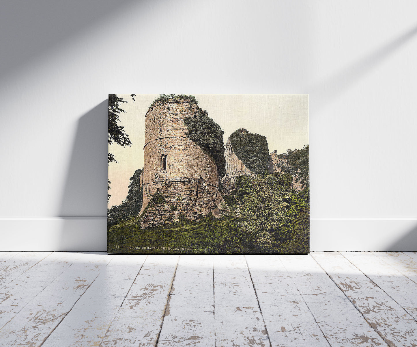 A picture of Castle, the round tower, Goodrich, England, a mockup of the print leaning against a wall