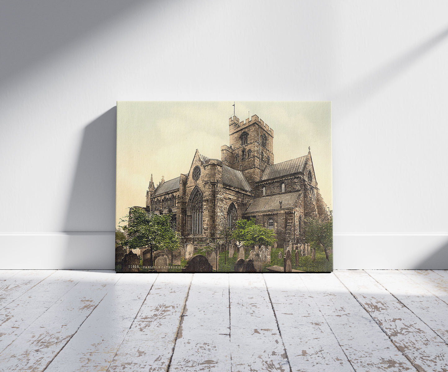A picture of Cathedral, Carlisle, England, a mockup of the print leaning against a wall