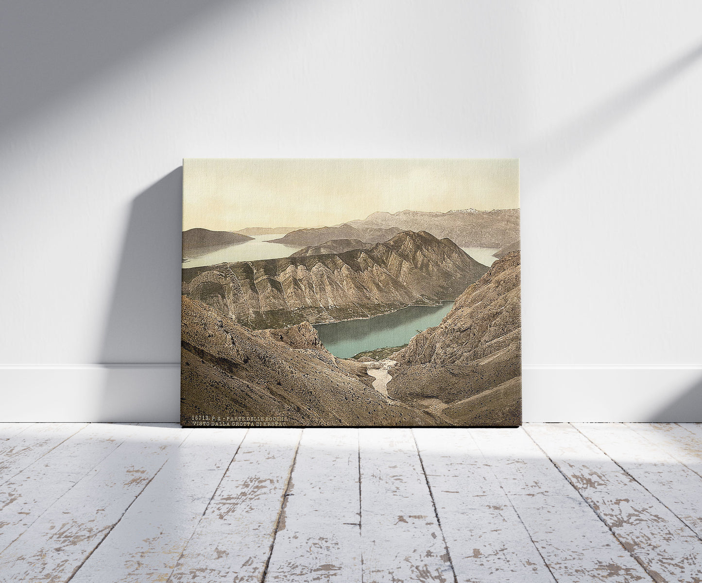A picture of Cattaro, view of the gulf from Krstac Grotto, Dalmatia, Austro-Hungary, a mockup of the print leaning against a wall