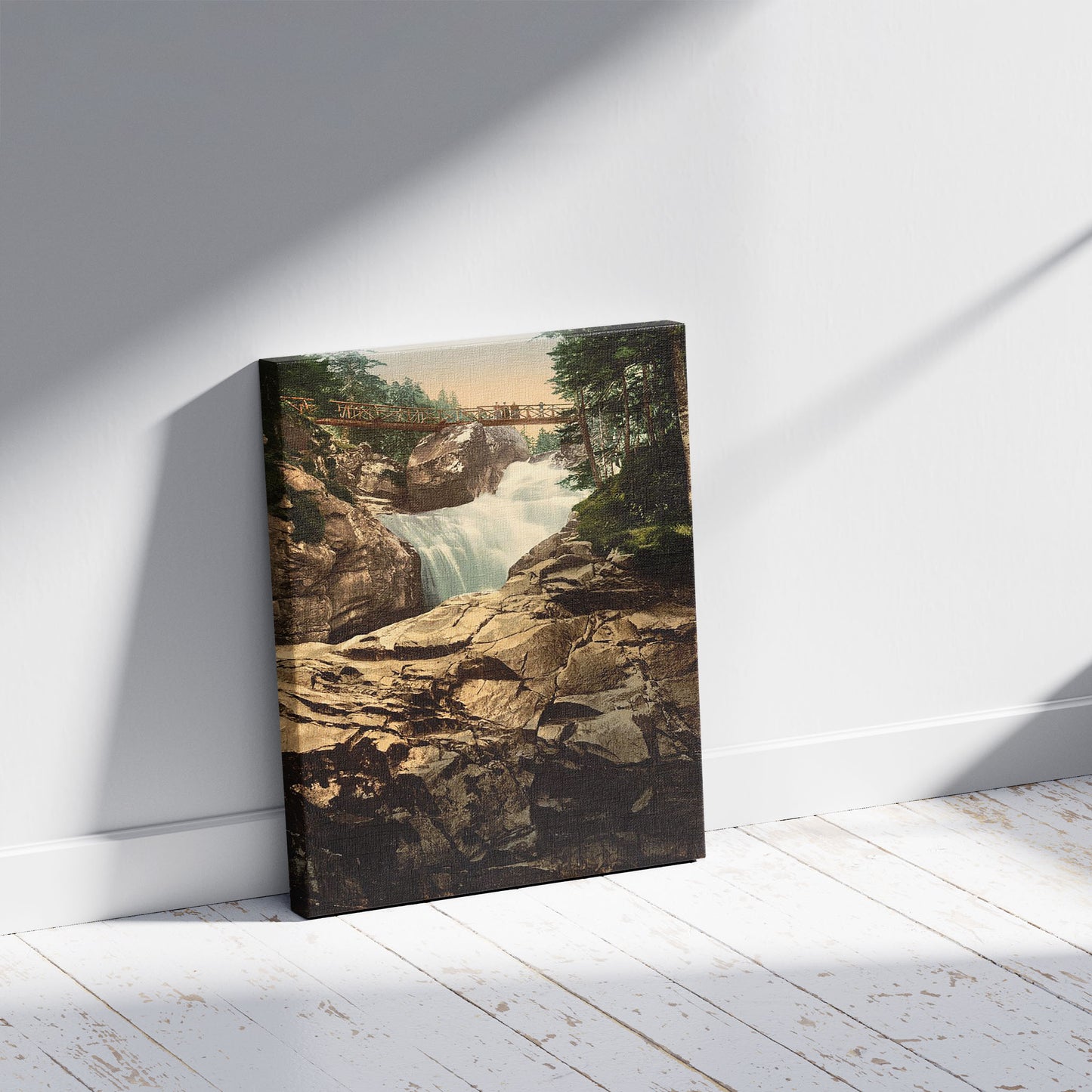 A picture of Cerisy (i.e., Cérisey) waterfall, Pyrenees, France, a mockup of the print leaning against a wall