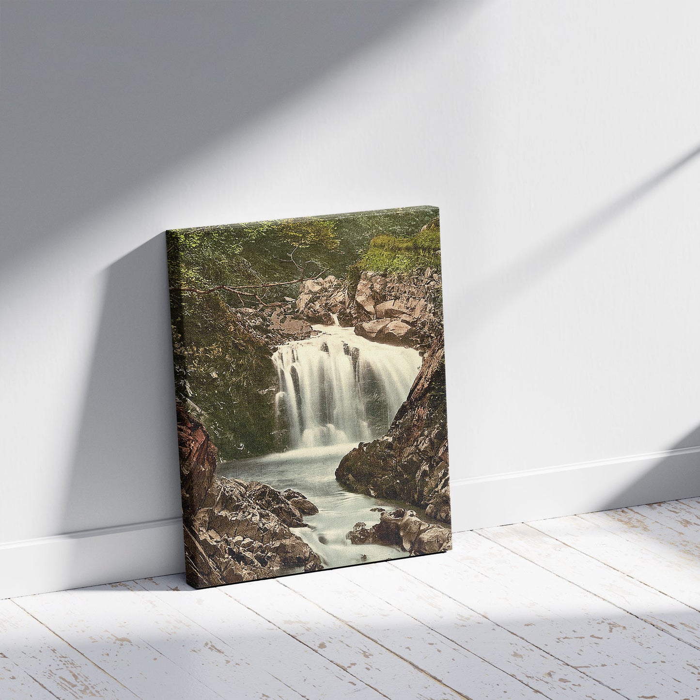 A picture of Ceunant Mawr, Lower Fall, Llanberis, Wales, a mockup of the print leaning against a wall