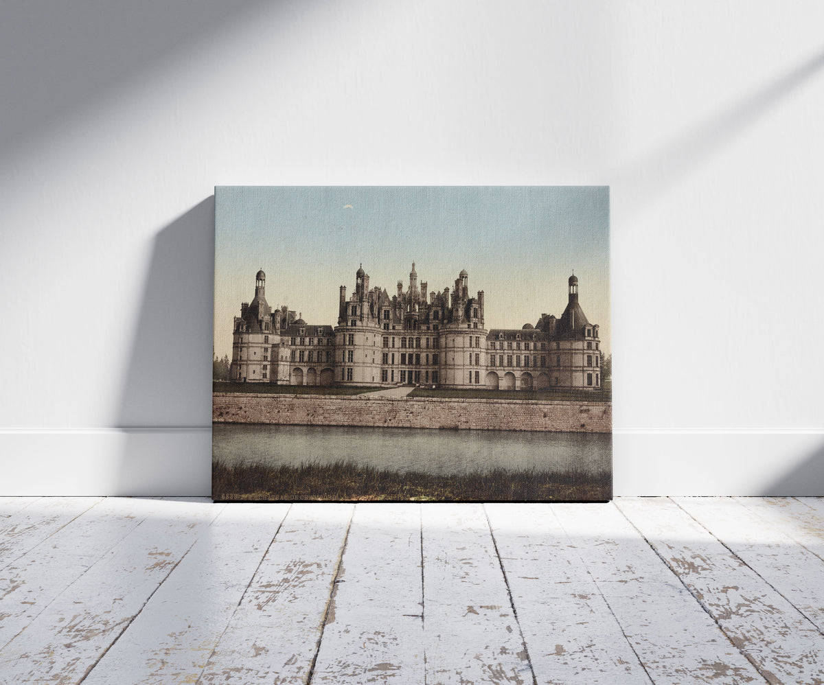 A picture of Château de Chambord, a mockup of the print leaning against a wall