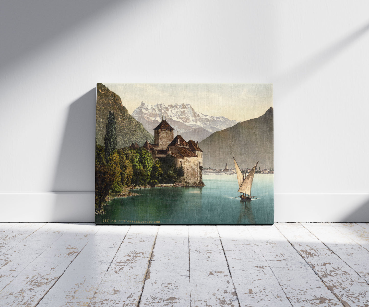 A picture of Chillon Castle, and Dent du Midi, Geneva Lake, Switzerland, a mockup of the print leaning against a wall