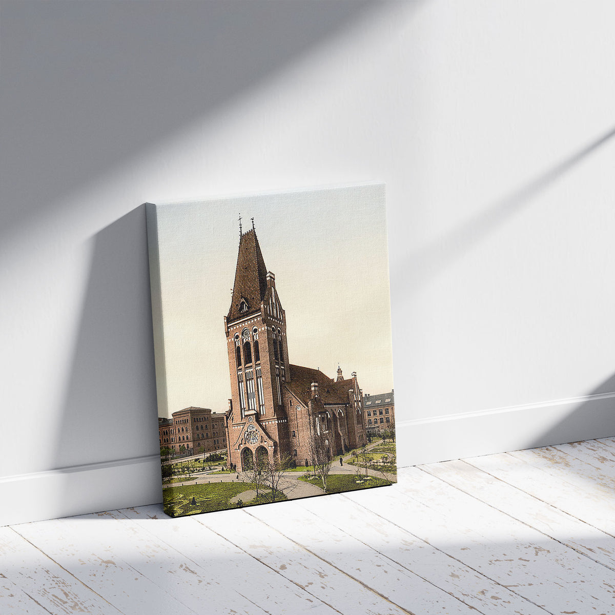 A picture of Christ Church, Bromberg, Silesia i.e., Posen Germany (i.e., Bydgoszcz, Poland), a mockup of the print leaning against a wall