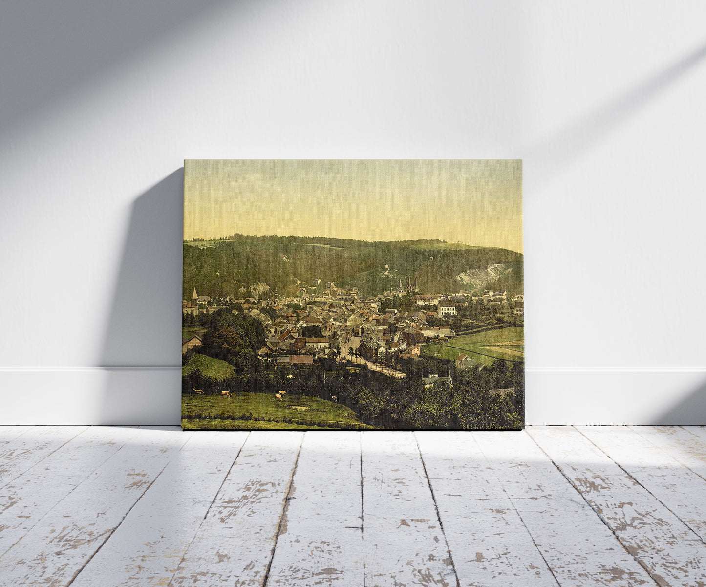 A picture of Cityscape of Spa, Belgium, a mockup of the print leaning against a wall
