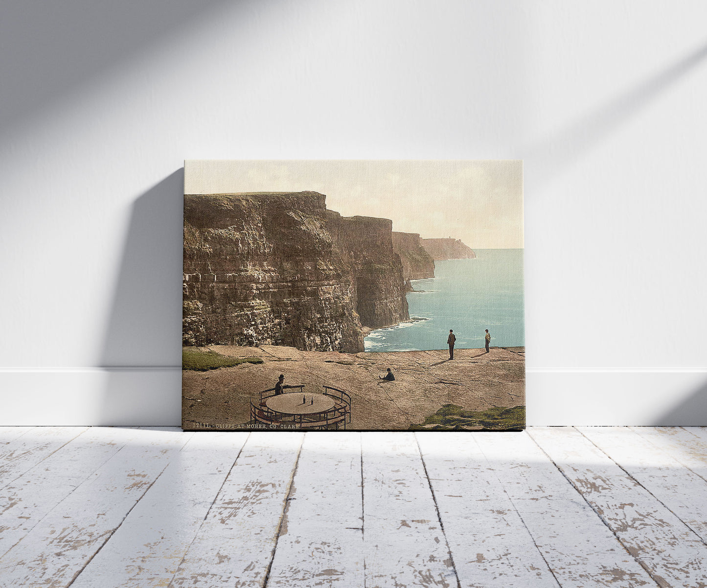 A picture of Cliffs at Moher. County Claire. (i.e. Clare), Ireland, a mockup of the print leaning against a wall