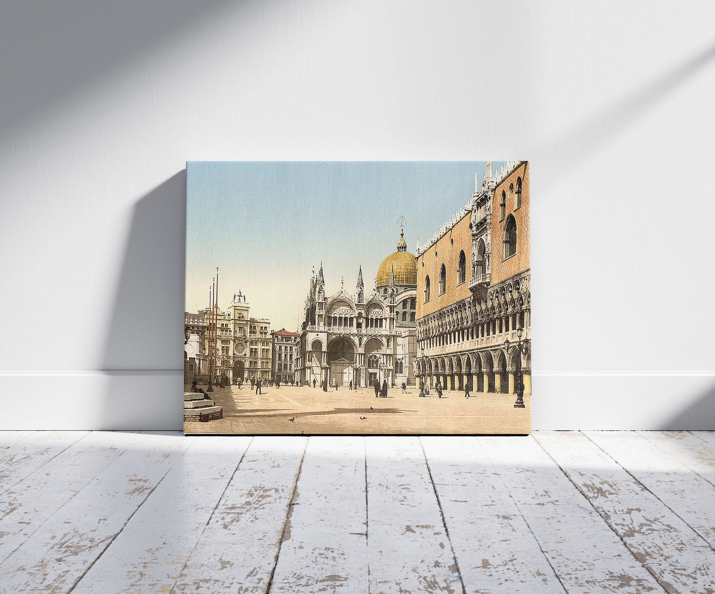 A picture of Clock tower, St. Mark's, and Doges' Palace, Piazzetta di San Marco, Venice, Italy, a mockup of the print leaning against a wall
