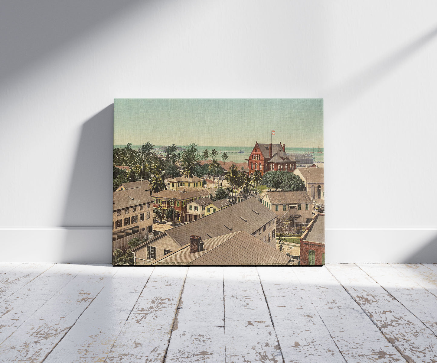 A picture of Custom House and harbor, Key West, a mockup of the print leaning against a wall