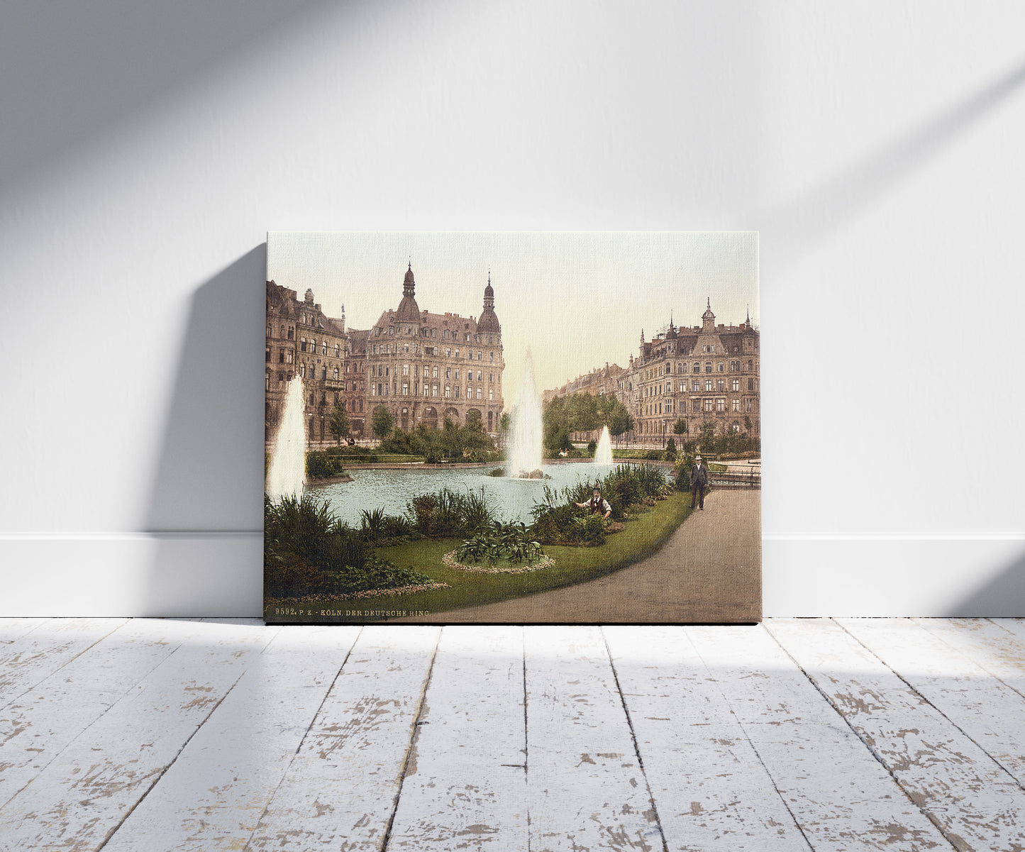 A picture of Der Deutsche Ring, Cologne, the Rhine, Germany, a mockup of the print leaning against a wall