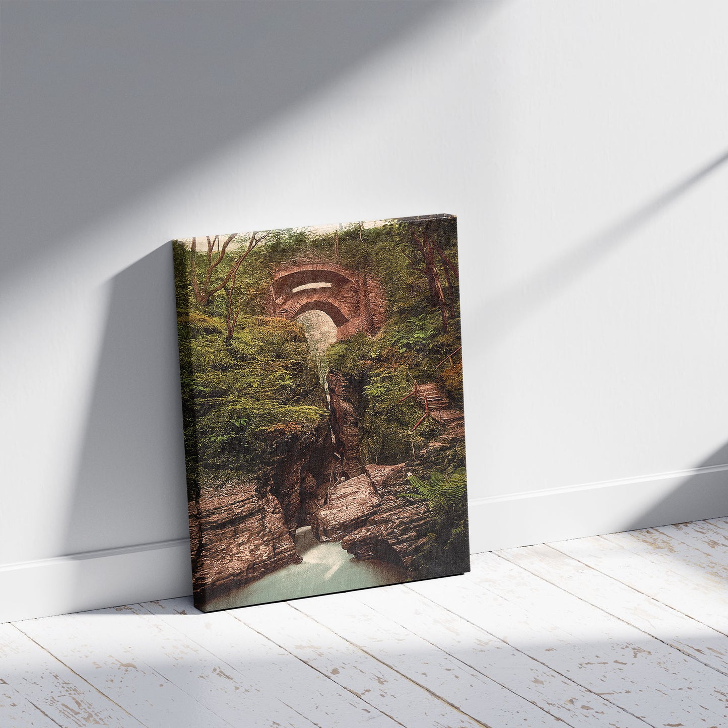 A picture of Devil's Bridge, Aberystwith i.e., Aberystwyth, Wales, a mockup of the print leaning against a wall