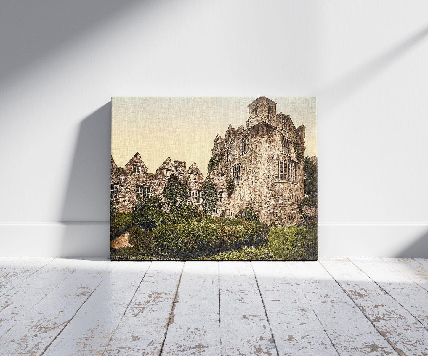 A picture of Donegal Castle. County Donegal, Ireland, a mockup of the print leaning against a wall