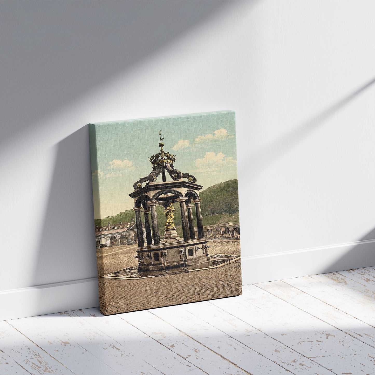 A picture of Einsiedeln, the fountain, Lake Lucerne, Switzerland, a mockup of the print leaning against a wall