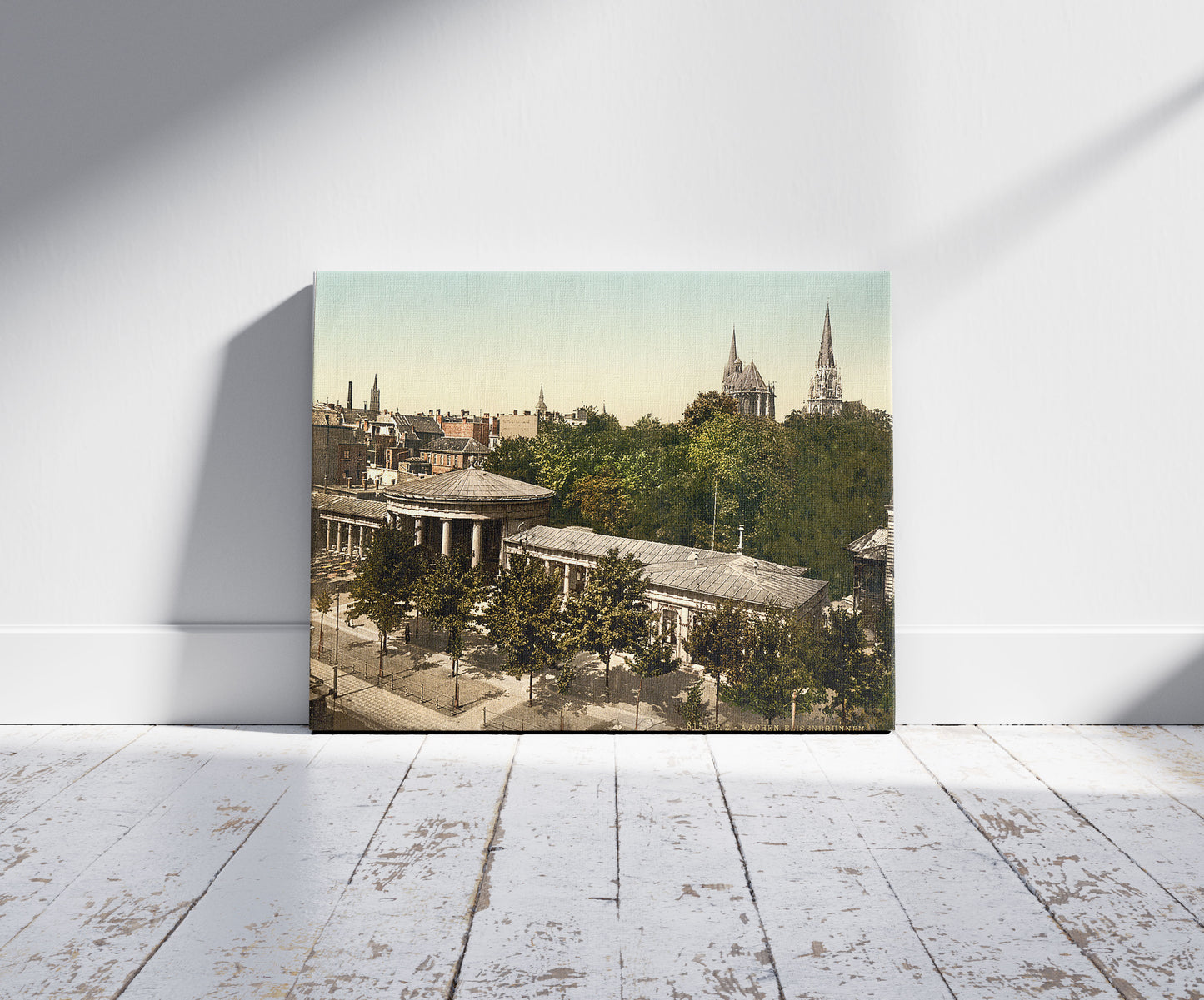 A picture of Elise's Fountain, Aachen, the Rhine, Germany, a mockup of the print leaning against a wall