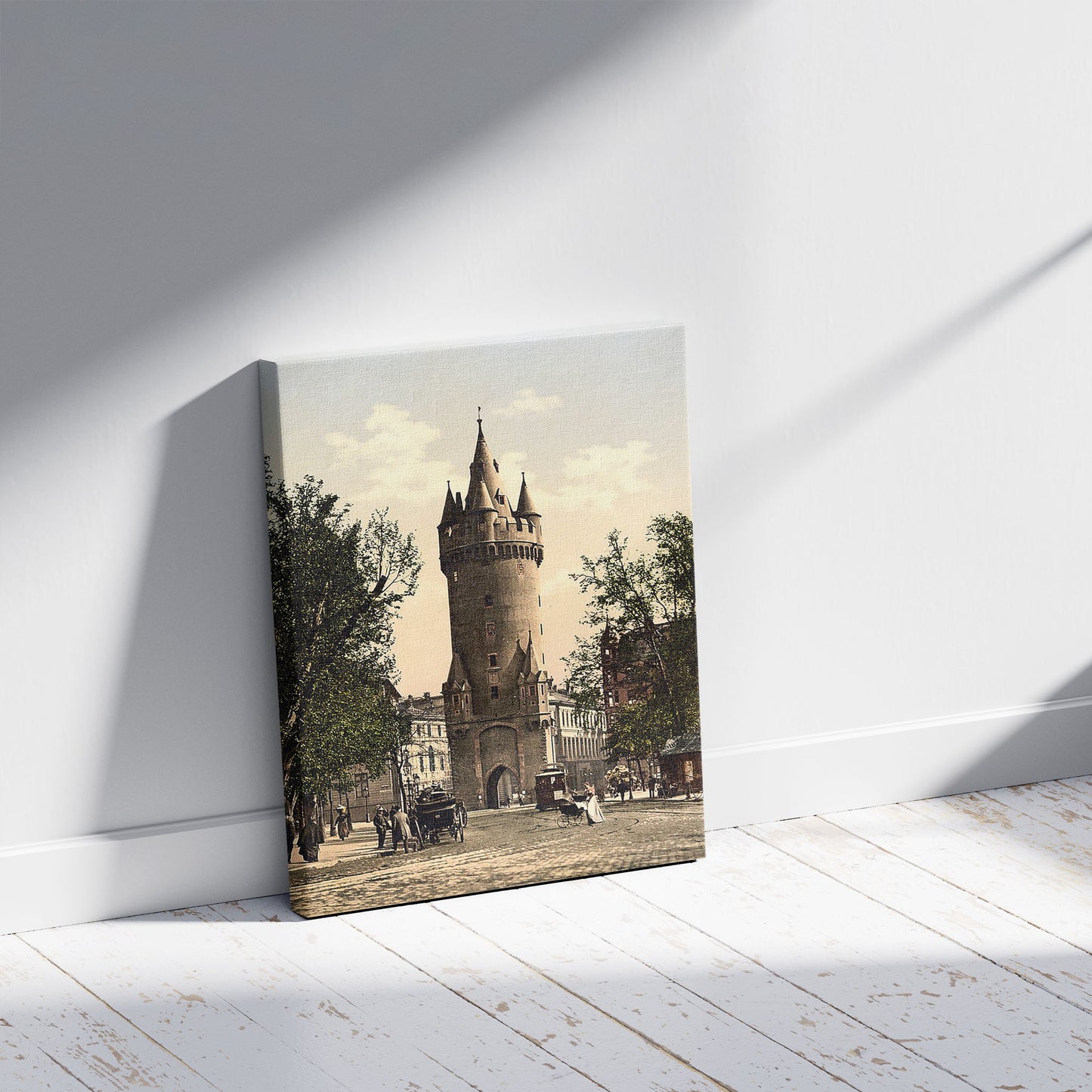 A picture of Eschenheimer Gate, Frankfort on Main (i.e. Frankfurt am Main), Germany, a mockup of the print leaning against a wall