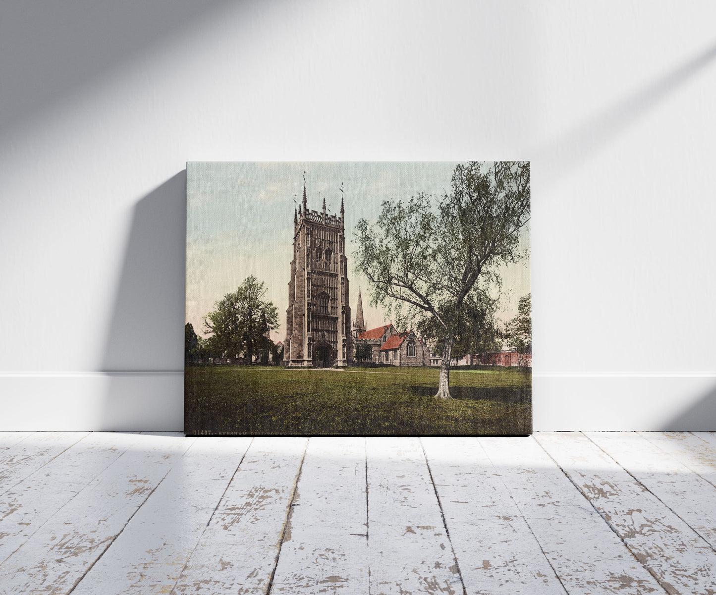 A picture of Evesham. Bell Tower and Two Churches, a mockup of the print leaning against a wall
