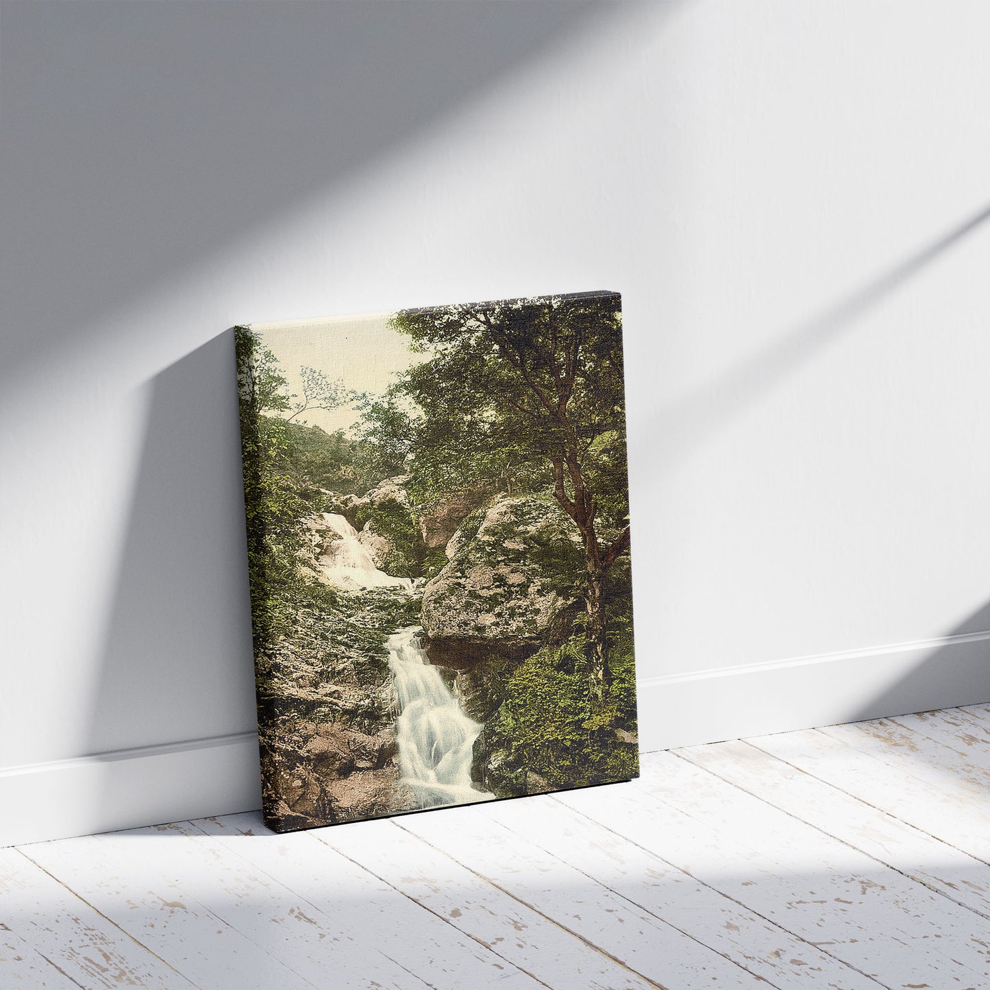 A picture of Fairy Glen Waterfall, Penmaenmawr, Wales, a mockup of the print leaning against a wall