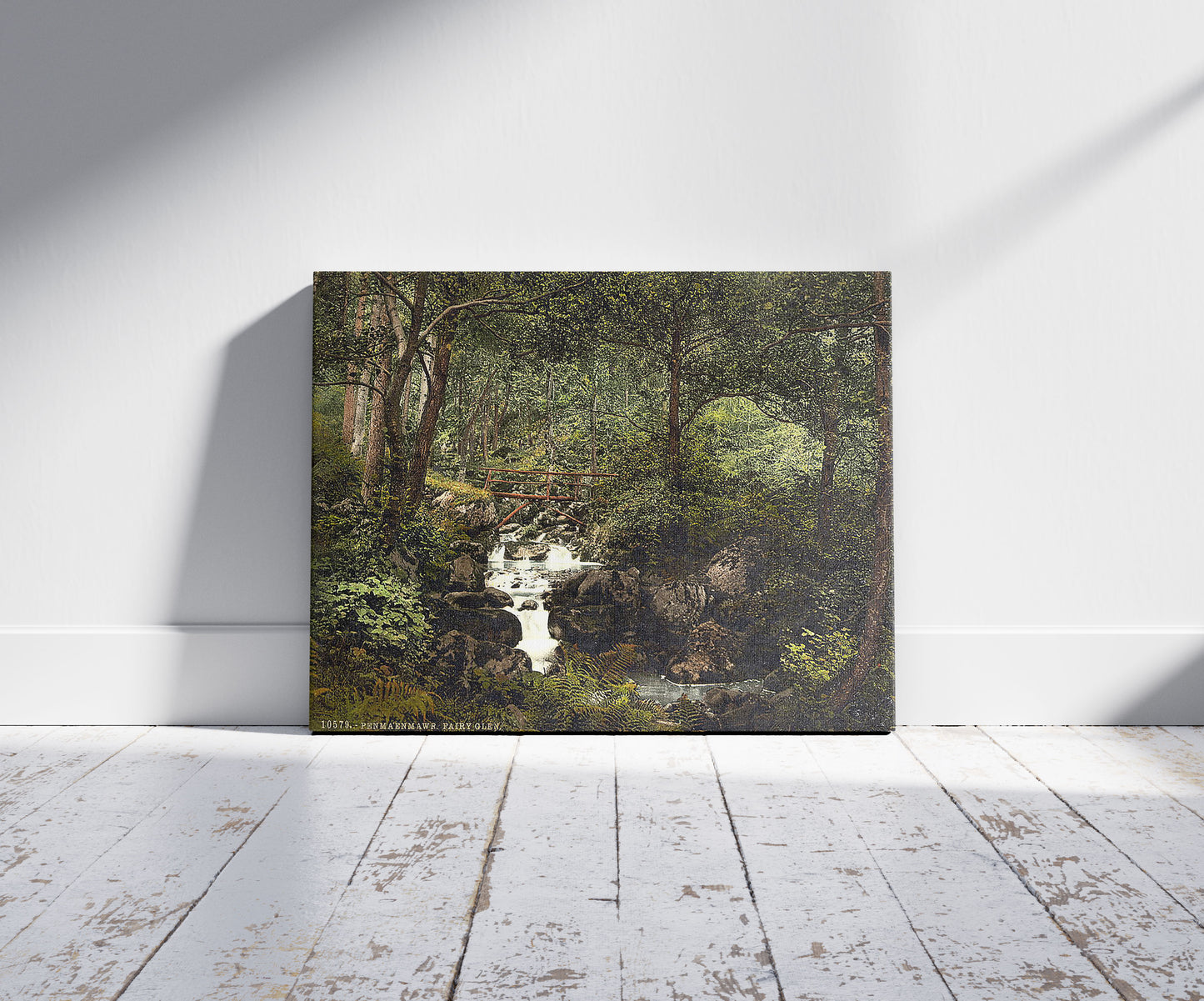 A picture of Fairy Glen Waterfall, Penmaenmawr, Wales, a mockup of the print leaning against a wall