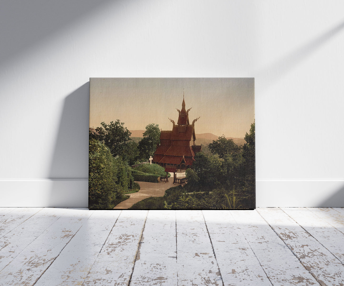 A picture of Fantoft Church, Bergen, Norway, a mockup of the print leaning against a wall