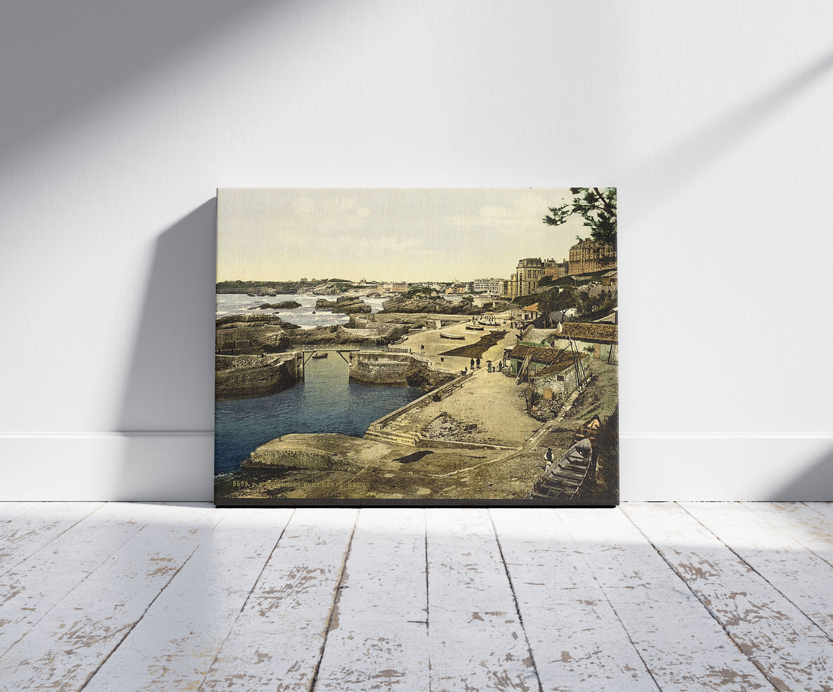 A picture of Fishing harbor, Biarritz, Pyrenees, France, a mockup of the print leaning against a wall