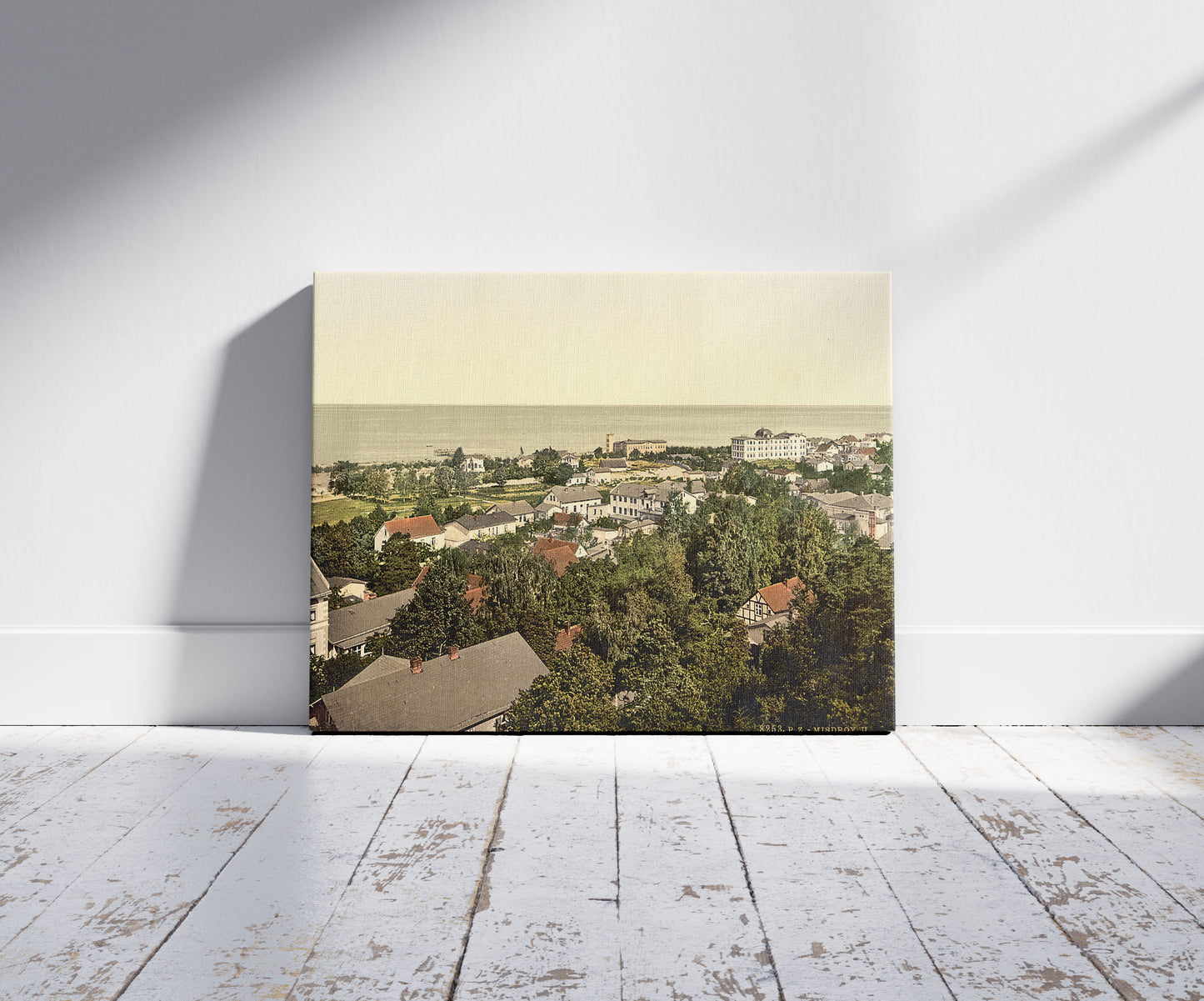 A picture of From the church, Misdroy, Pomerania, Germany (i.e., Międzyzdroje, Poland), a mockup of the print leaning against a wall