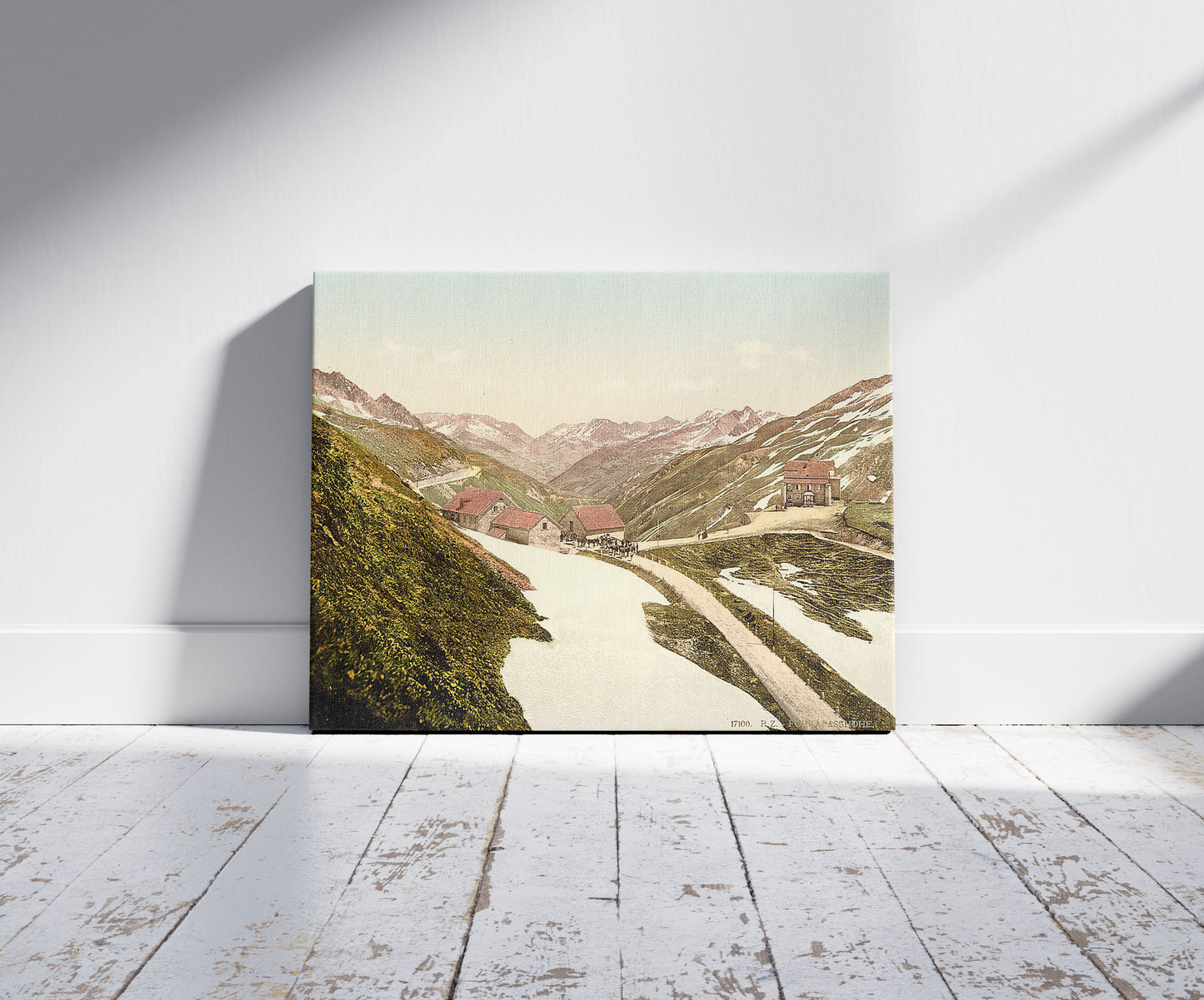 A picture of Fuka Pass, Bernese Oberland, Switzerland, a mockup of the print leaning against a wall