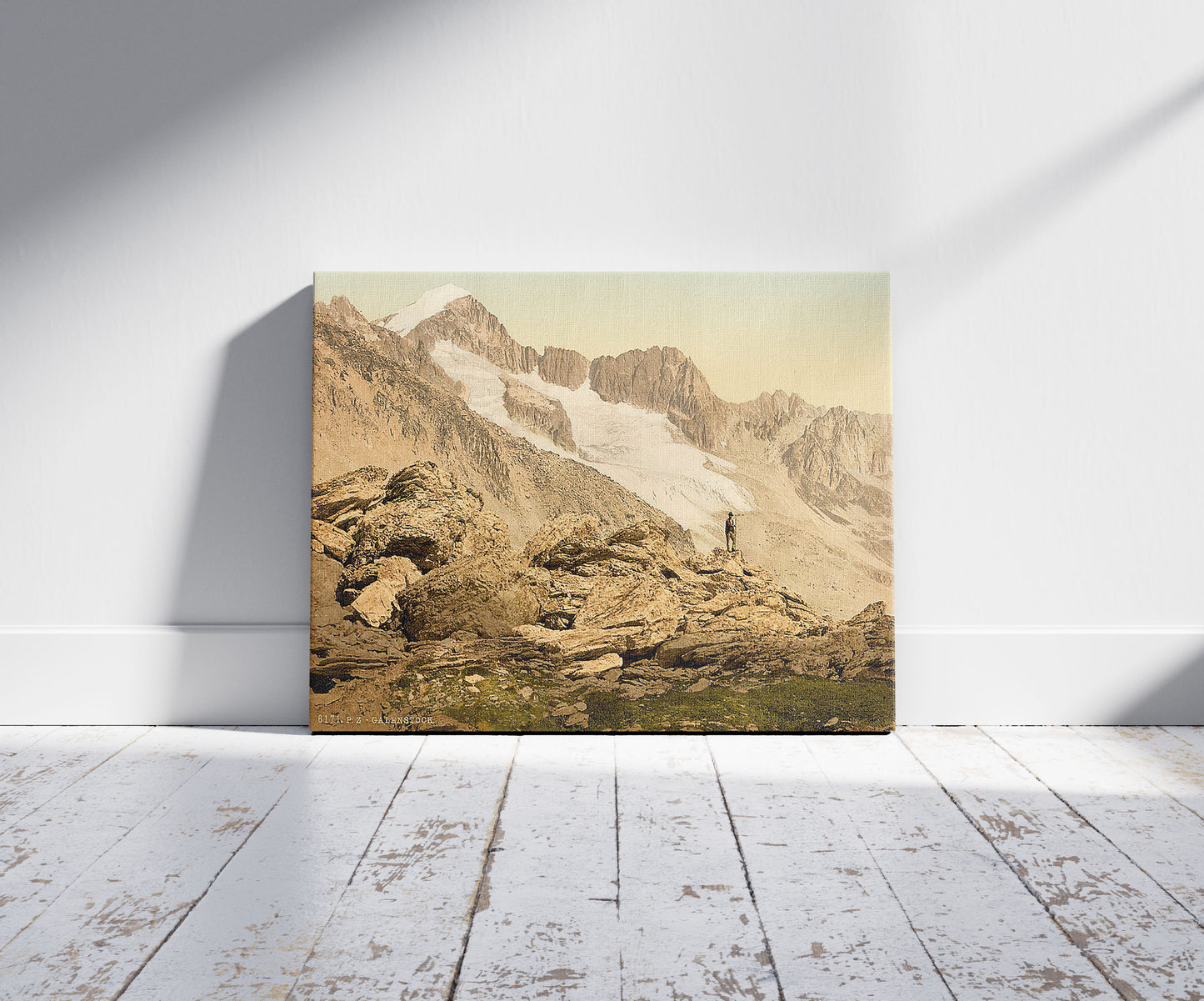 A picture of Furka Pass, Galenstock, from the Furkahorn, Bernese Oberland, Switzerland, a mockup of the print leaning against a wall