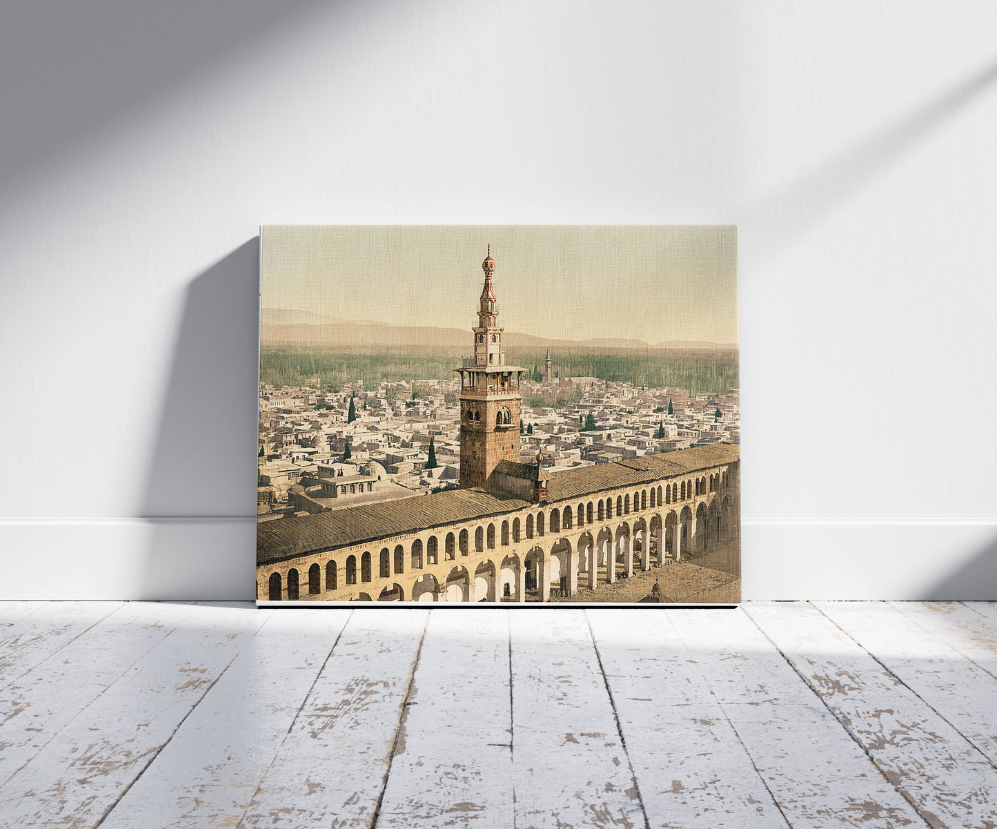 A picture of General view and Minaret of the Bride, Damascus, Holy Land, (i.e. Syria), a mockup of the print leaning against a wall