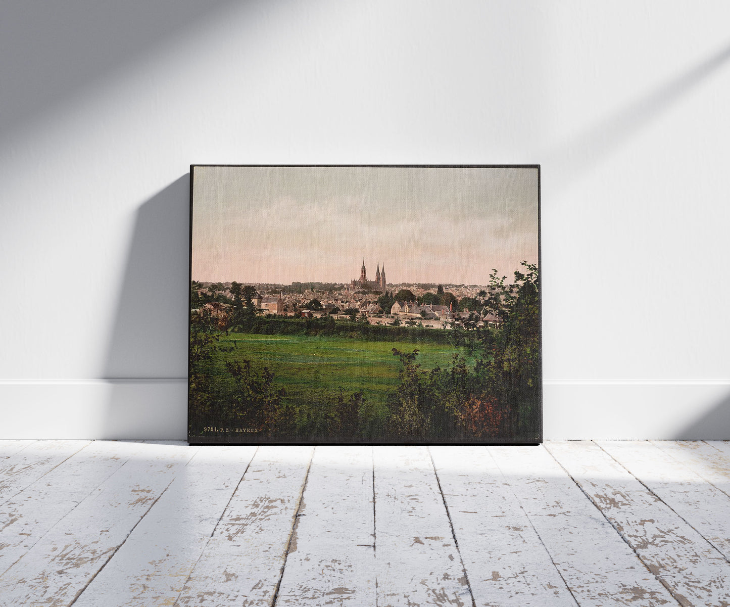 A picture of General view, Bayeux, France, a mockup of the print leaning against a wall