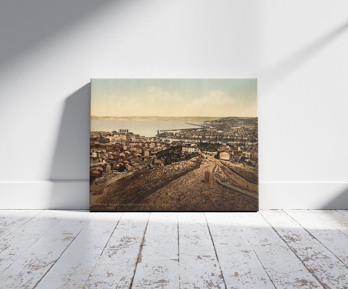 A picture of General view from Notre Dame de la Garde, Marseilles, France, a mockup of the print leaning against a wall