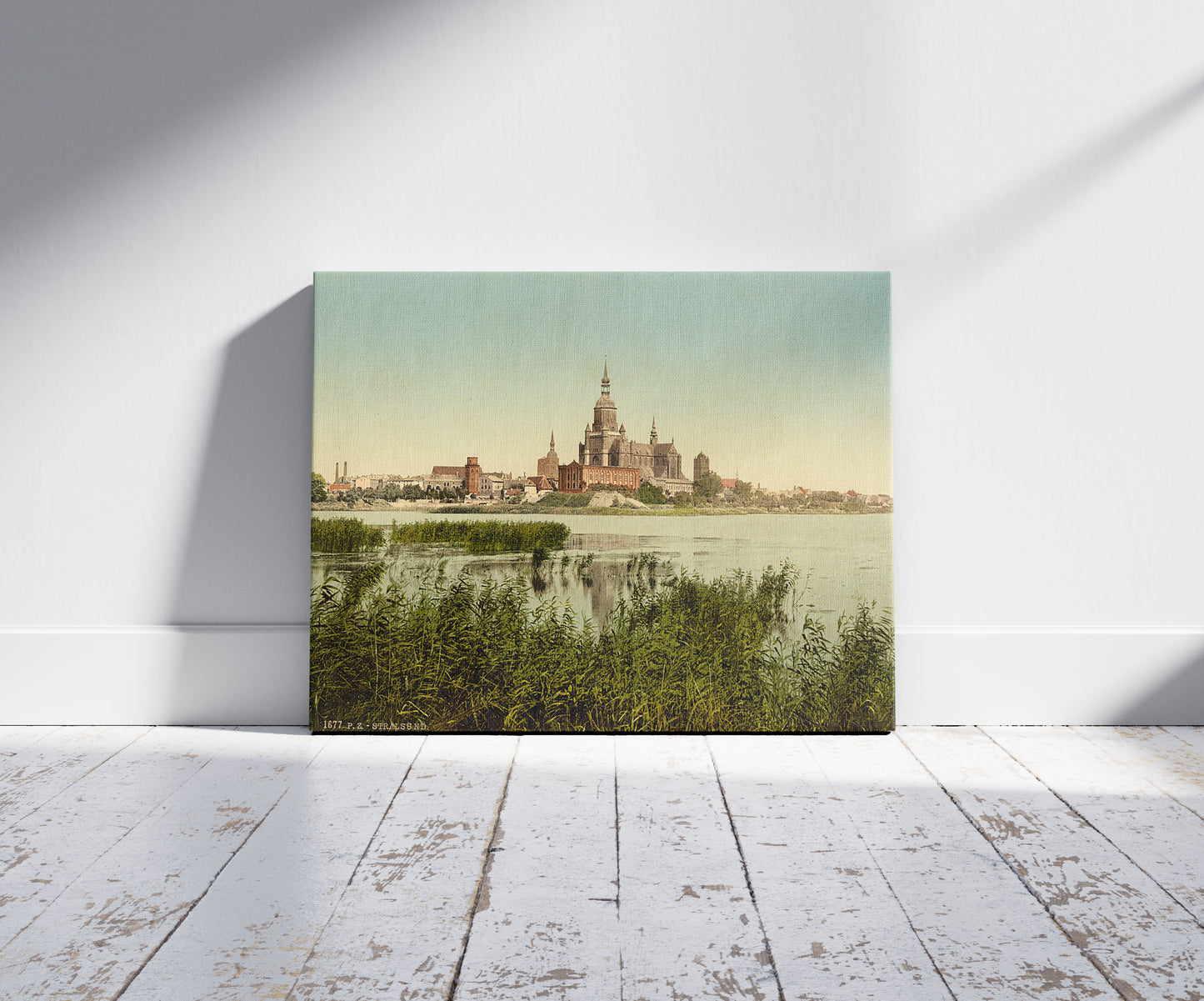 A picture of General view, from station, Stralsund, Pomerania, Germany, a mockup of the print leaning against a wall