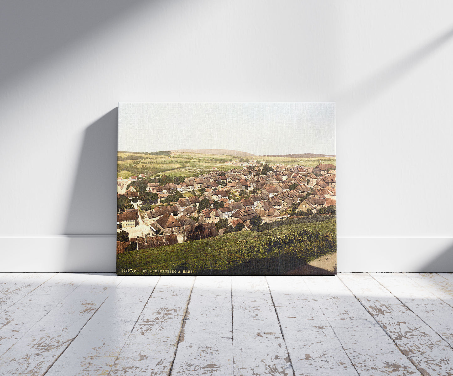 A picture of General view, St. Andreasburg, Hartz, Germany, a mockup of the print leaning against a wall