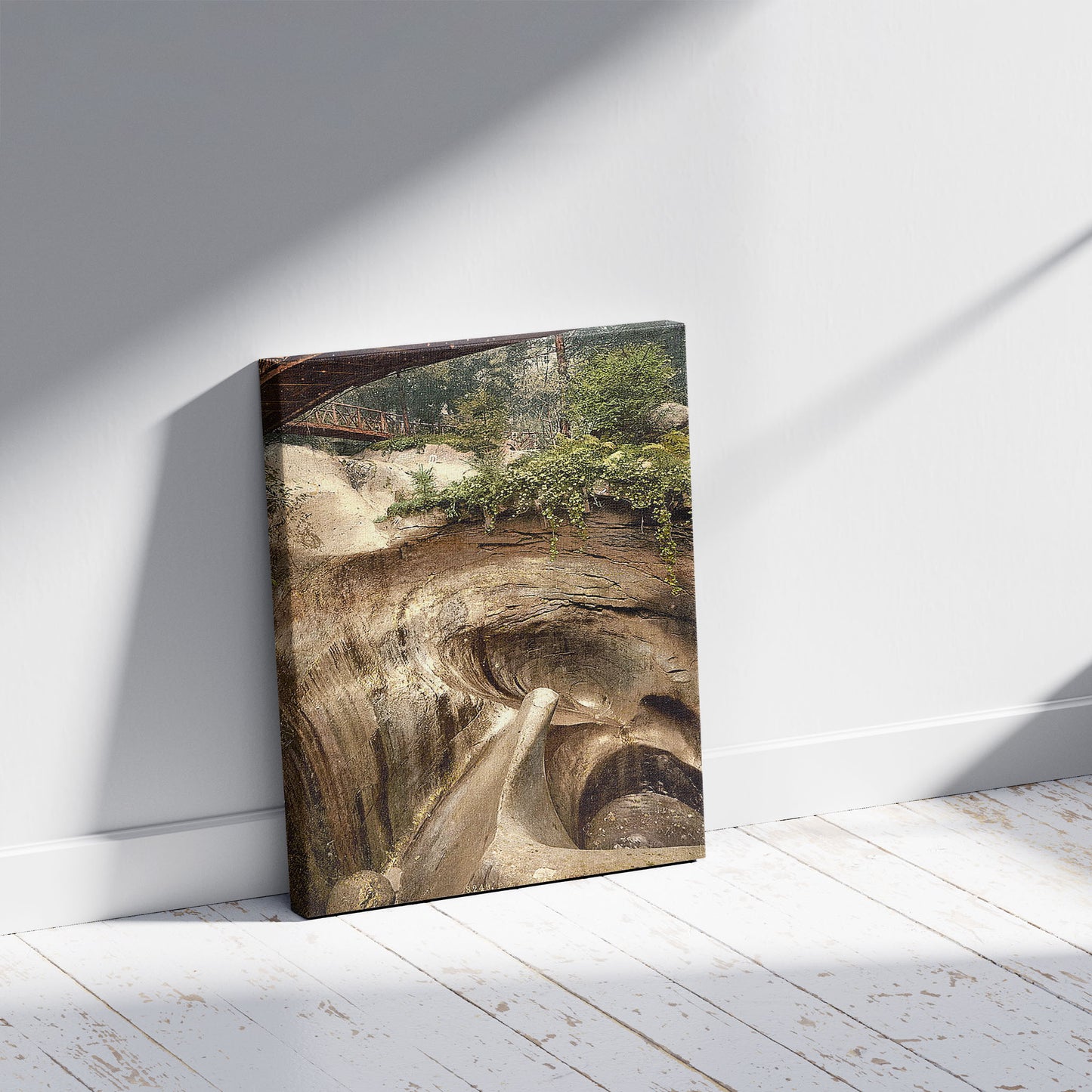 A picture of Glacier Garden, part of the artificial glaciers, Lucerne, Switzerland, a mockup of the print leaning against a wall