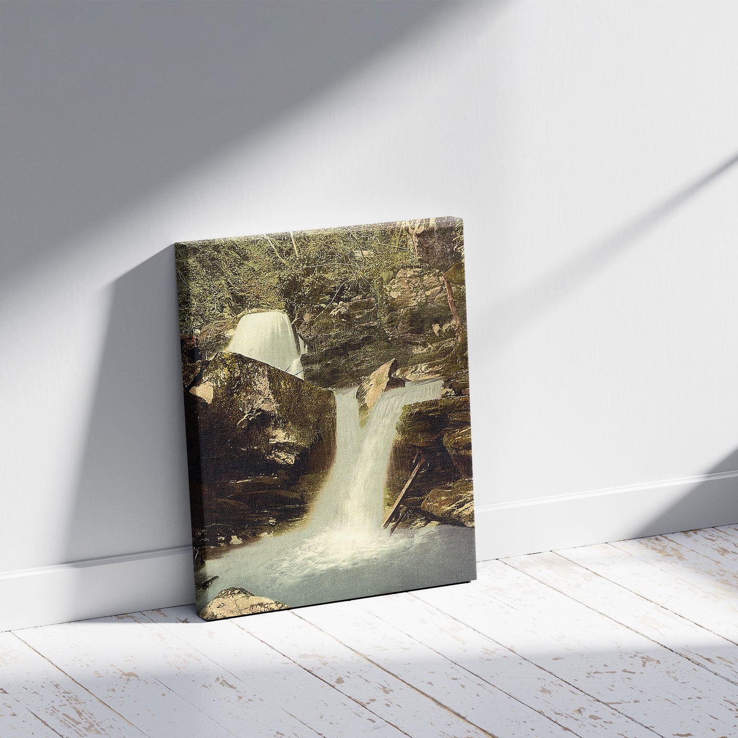 A picture of Glen Lyn, the upper falls, Lynton and Lynmouth, England, a mockup of the print leaning against a wall