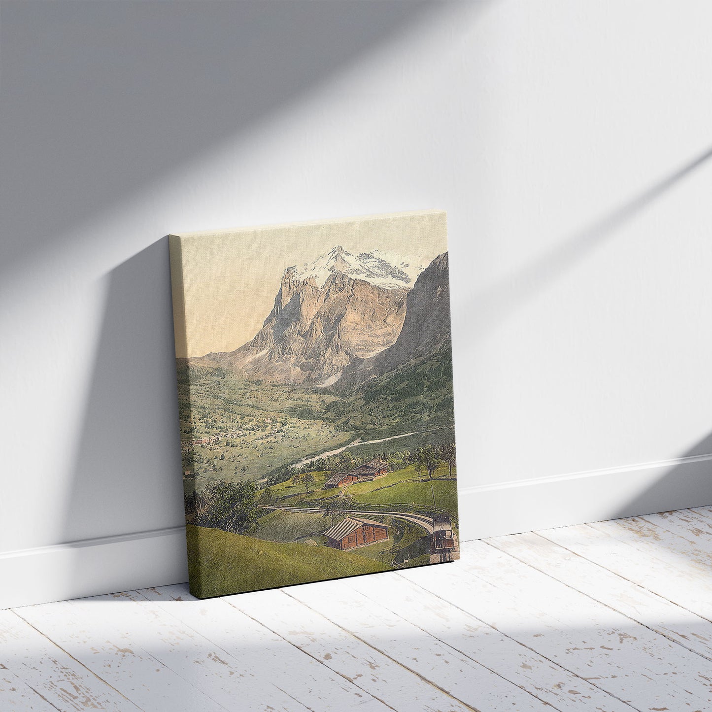 A picture of Grindelwald and Mount Wetterhorn, Bernese Oberland, Switzerland, a mockup of the print leaning against a wall