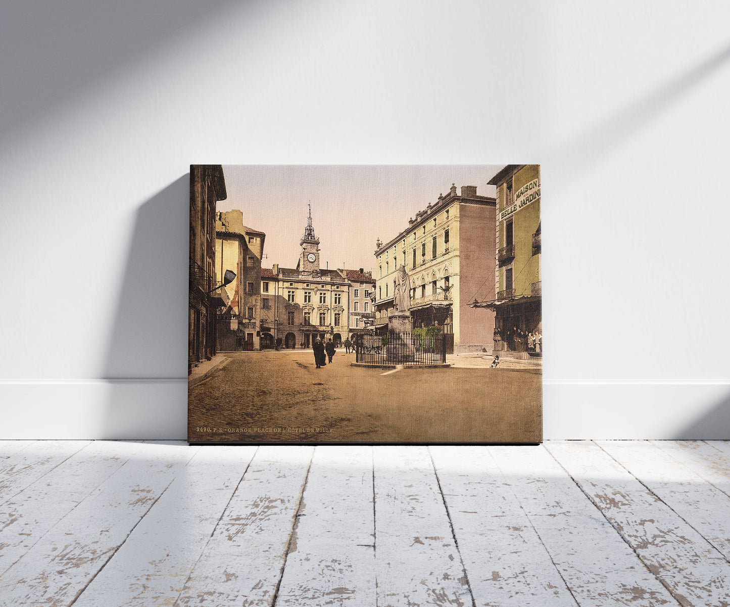 A picture of Hotel de ville place, Orange, Provence, France, a mockup of the print leaning against a wall