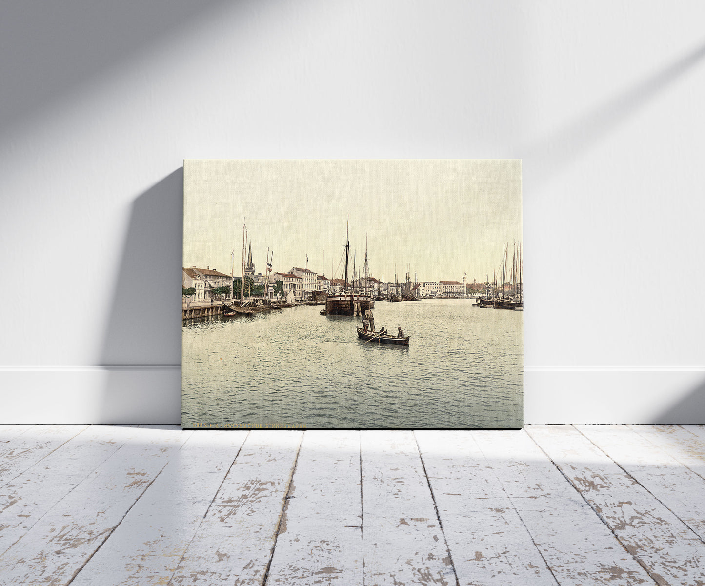 A picture of Inner harbor, Swinemunde, Pomerania, Germany (i.e., Świnoujście, Poland), a mockup of the print leaning against a wall