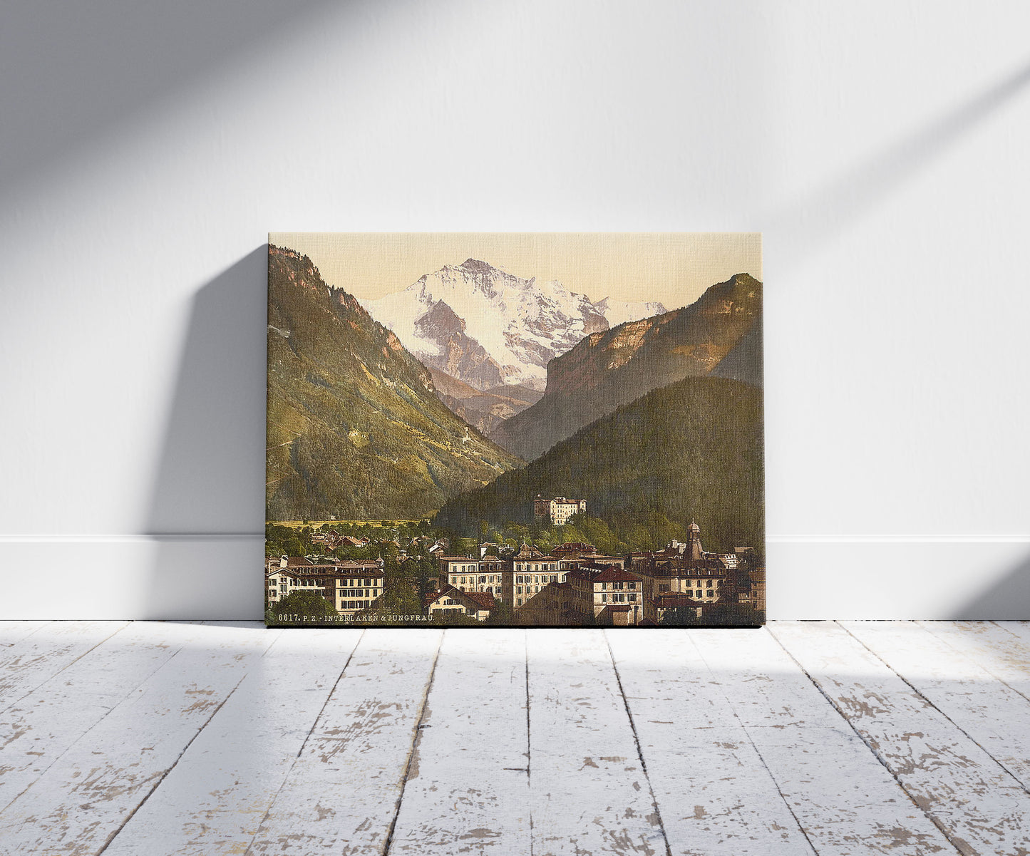 A picture of Interlaken, and the Jungfrau, Bernese Oberland, Switzerland, a mockup of the print leaning against a wall