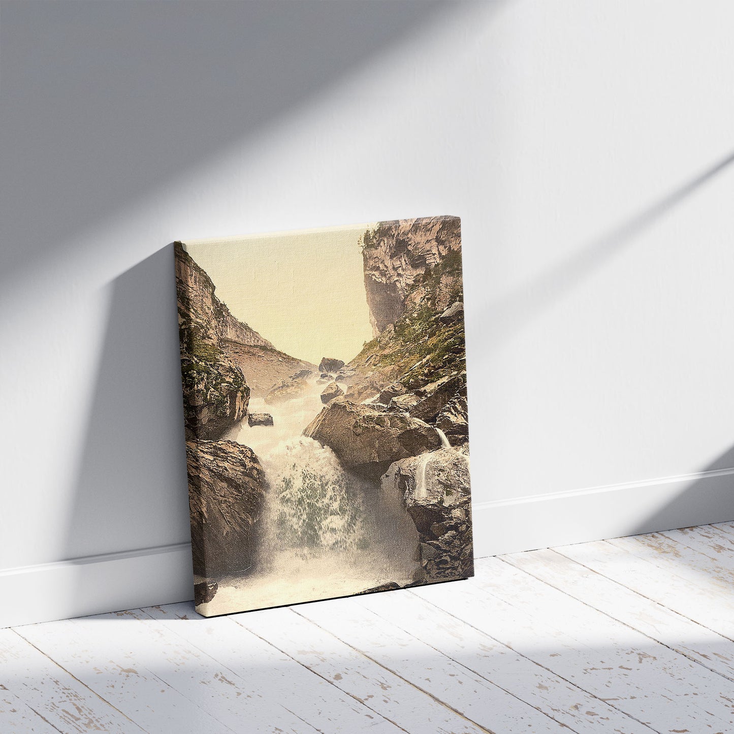 A picture of Kander fall, at Klus, Bernese Oberland, Switzerland, a mockup of the print leaning against a wall