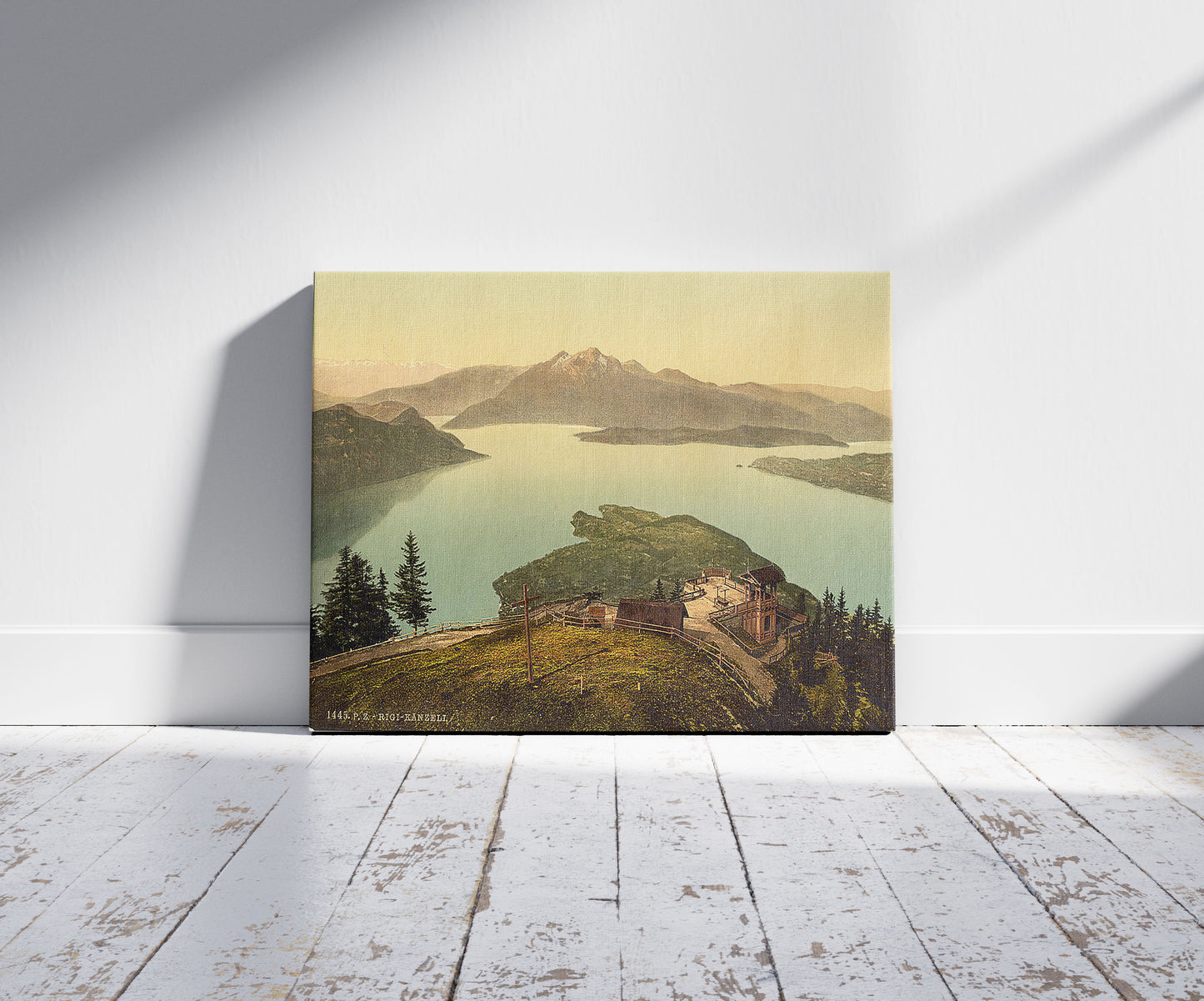 A picture of Lake of the Four Cantons, Pilatus, Switzerland, a mockup of the print leaning against a wall