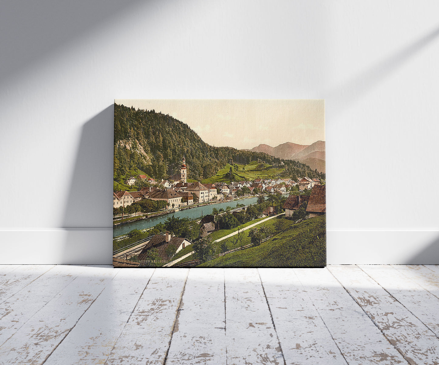 A picture of Laufen near Ischl from west, Upper Austria, Austro-Hungary, a mockup of the print leaning against a wall