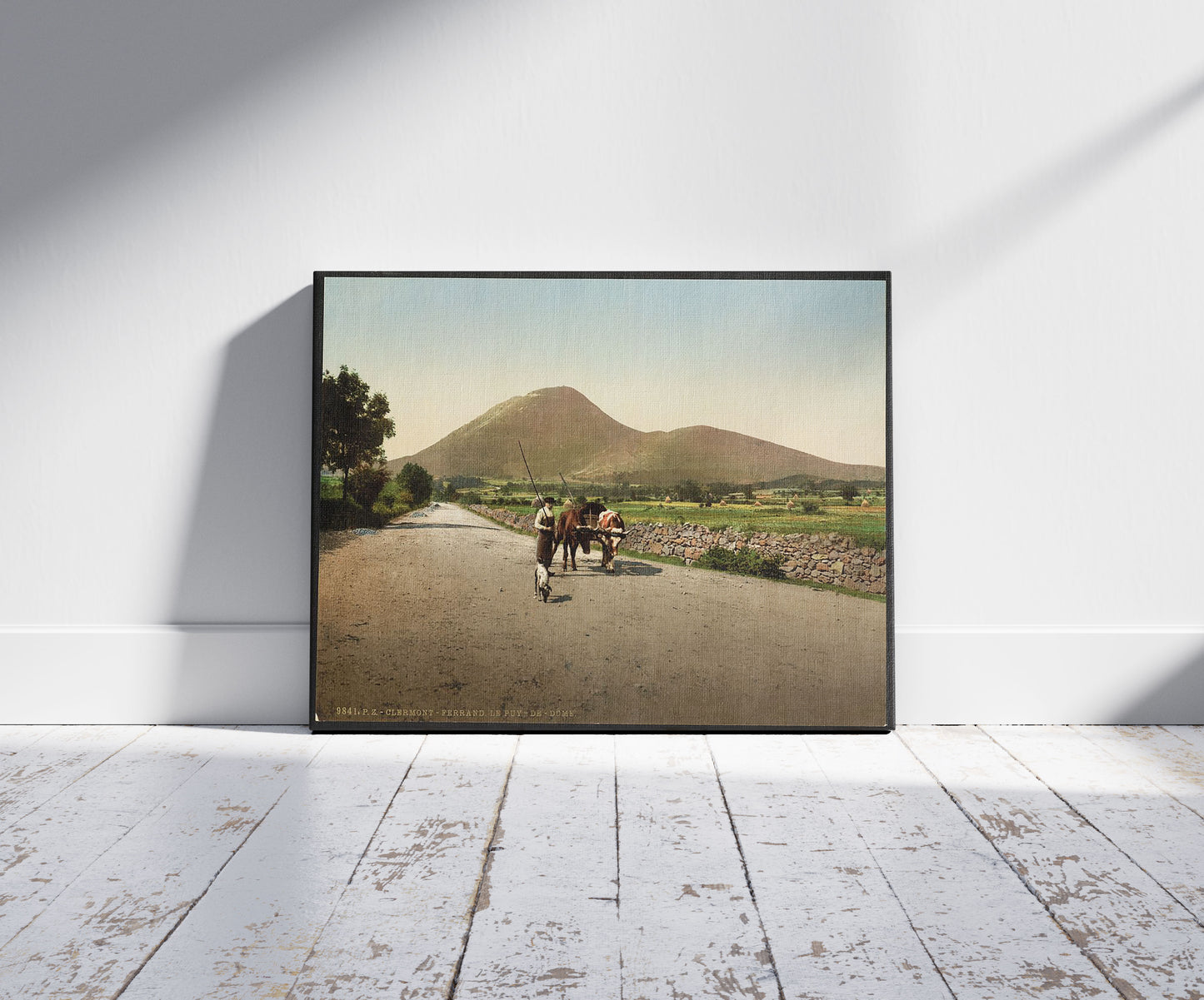 A picture of Le Puy de Dôme, Clermont-Ferrand, France, a mockup of the print leaning against a wall